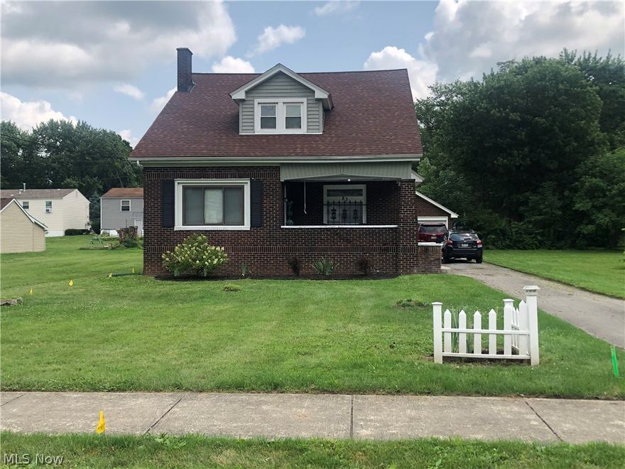 This beautiful all brick two story home is full of character sits on 3 city lots . Currently this home has been converted to a multi-family up and down duplex. First floor has large living-room with lovely fireplace, original woodwork and hardwood floors.  Kitchen features original farm house sink and all appliances. 2 large first floor bedrooms and updated bath.  Access to the full basement with laundry area. Upstairs unit features  large bedroom with huge closets for storage. Updated kitchen with all appliances and full bath.  Updates include newer roof, furnace and central air in 2020. Oversized 2 car detached garage.