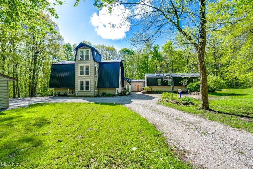 Welcome to paradise in the country on over 5 acres with an INDOOR POOL! This property offers so much for all seasons. Driving up past 2 grassy acres, you’ll enter the woods of privacy. You’ll be greeted into a 3-story high vaulted entrance with a beautiful modern chandelier. Starting downstairs in the home, there are 2 bedrooms, 1 full bath and a half, large family recreation room for movies, mudroom, then a large laundry/unfinished rec room towards the back. On the main floor there is a living room, vaulted family room, home office, dining room, your dream custom kitchen, half bath, as well as a breakfast room with large wet bar/pantry wall. The upstairs holds the master suite and additional 2 bedrooms with another full bath. Walk through the sunroom to breezeway and arrive at the pool house side of the property. The pool house has a large indoor pool and bar, as well as a full bathroom, gym, and sauna with brand new unit. Just outside the bar door, is a hot tub as well. Wandering outside, the backyard is fully fenced and ready for your chickens! The south side of the property behind the playground, offers trails and a creek along with views of multiple waterfalls. The 4-door garage is deep to house all your tools, and outdoor toys and tractors. So many new appliances and features to this home! Updates include Metal Roof 2022, 2 HVAC electric heat pumps 2022, commercial size kitchen appliances and quartz countertop 2023, full septic system 2024. Lots of renovations on top of these throughout home