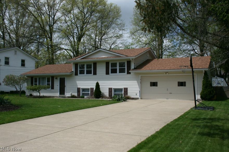 Delightful 3 bedroom, move-in condition 1  bath split level in a very desirable neighborhood.  Super clean home. Very bright with extra large living room, leading to a nice dining/kitchen nook area with new Pergo flooring. Access to a nice, under-roof, 12 x 22 patio off dining area, into a nice wooded (completely fenced-in back yard) with a large shed! Kitchen offers bright cabinetry (all appliances stay).  Upper level offers three nice-sized bedrooms (hardwood floors under carpet with two of the bedrooms).  Lower level offers a huge 13 x 21 rec room and laundry room (washer and dryer stays). Exterior, five-year old vinyl siding and shingles. Move in ready! Call on this beauty today!  She won't last long!