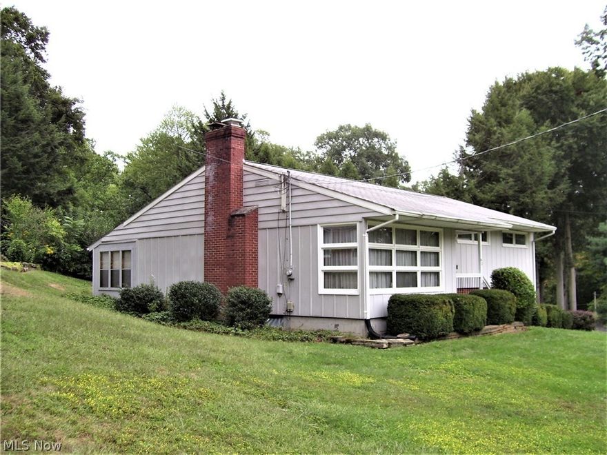 Must see the inside, larger than it looks. Lovely home situated on 2 lots and one block from a city park. Fireplace in the living room has been converted to gas. Formal dining room. Large Florida room leads to the 15' x 11' deck, great for enjoying the private rear yard.  Whole house attic fan, wonderful if you don't want to turn on the central air.  Furnace replaced 8/2015.