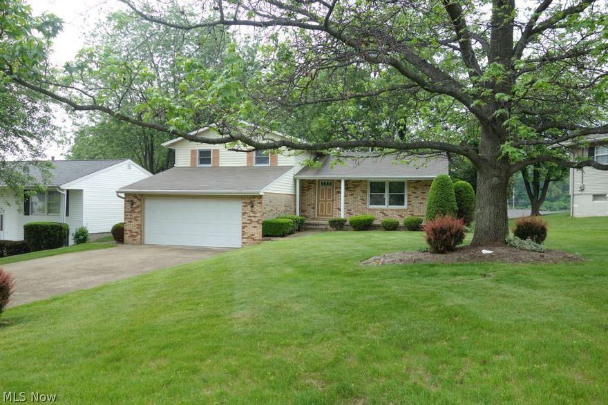 Beautiful split level home placed on a large lot with a nice back yard that is set higher on the hill than neighbors behind creating privacy for homeowners. There is an awesome big sun room with three walls of windows and door that leads out to the nice brick patio at the back of the house. A pretty floor to ceiling brick fireplace in one of the living spaces. The master bedroom has a door to one of the two full bathrooms that is shared with the other two bedrooms upstairs. Down in the basement is a bar, a great bonus space, the utility room, and room for storage.