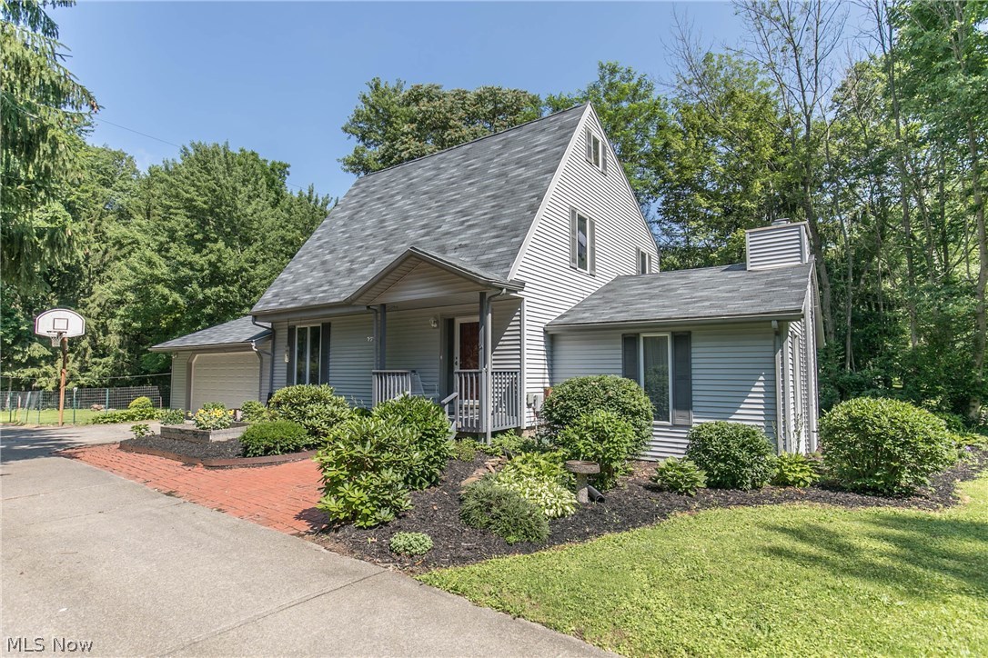 Remarkable Room in this modified 2-1/2 story 4 BR, 3BA Cape set on a wonderful Franklin Township lot w/ great curb appeal. Set apart from the hustle & bustle, enjoy living within a stone's throw of everything you need: downtown Kent, KSU, Rts. 59,261,43, shopping, restaurants, MORE! Large kitchen with island was updated in 2014 w/ new cupboards w/ pullouts, new countertops. Laminate wood flooring in large entry, living, dining and kitchen. Step-down Great Room from entry boasts a gas-log fireplace. Carpets throughout home have been replaced within last few years. Newer AIO (air injection oxidation) water system not only provides great tasting water, but protects water-based mechanicals in the home! AC and Furnace new in 2005 and NEW ROOF in JUNE 2018! Serviceable vinyl siding and wonderful 2-car garage plus shed in fully-fenced doggie or kid play yard round out the amenities. New Dishwasher, 2015. Electric Panel ~ 6 yrs. old. Washer and Dryer are included as well as One-Year home warra