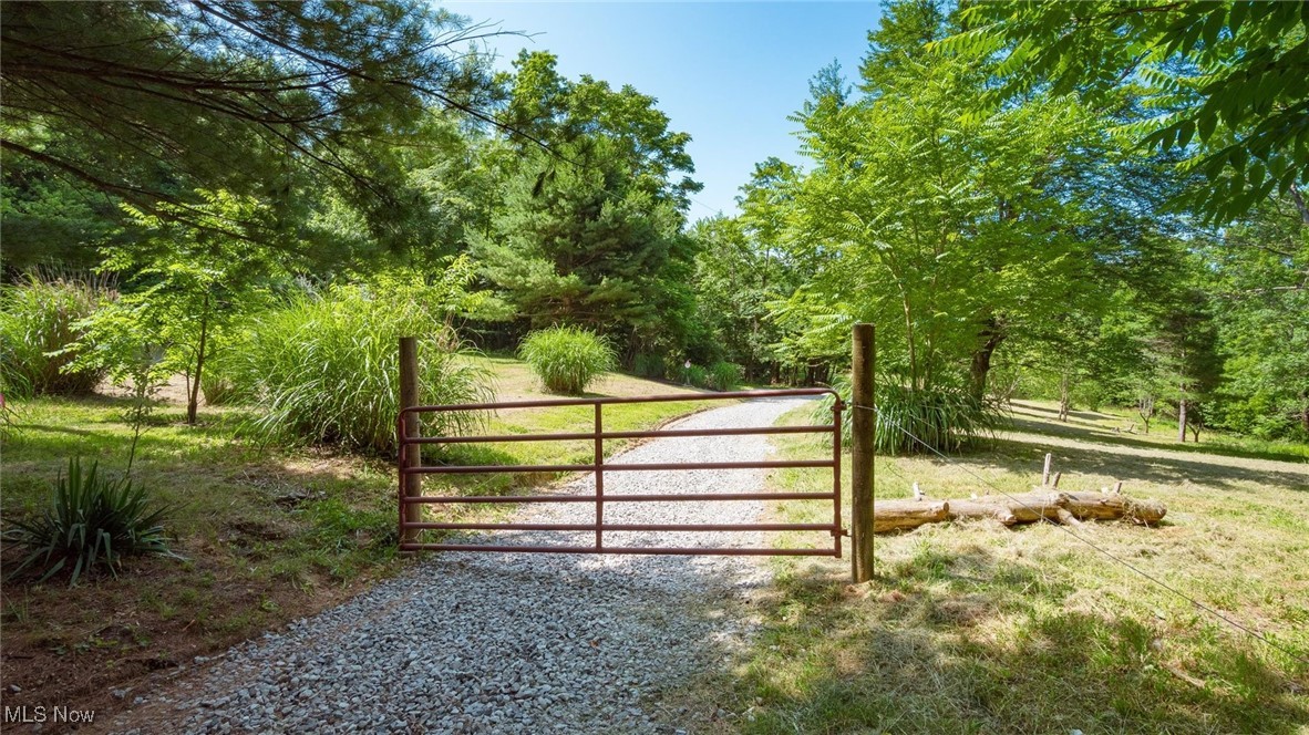 Nature Lover’s Paradise on 10.39 Acres!
Discover the perfect blend of seclusion and convenience on this beautiful 10.39-acre property. A gated entrance and new gravel drive welcome you to a peaceful, private setting ideal for outdoor enthusiasts. Enjoy excellent deer and turkey hunting, explore established ATV trails, or relax surrounded by mature timber, fruit trees, and wild blackberries.
The property features multiple potential homesites, including a stunning cleared hilltop at the rear—perfect for building your dream retreat with a view. County water is available, and electric is already on site, making your build plans even easier.
Whether you're looking for a private getaway, hunting land, or a forever home location, this slice of nature has it all.