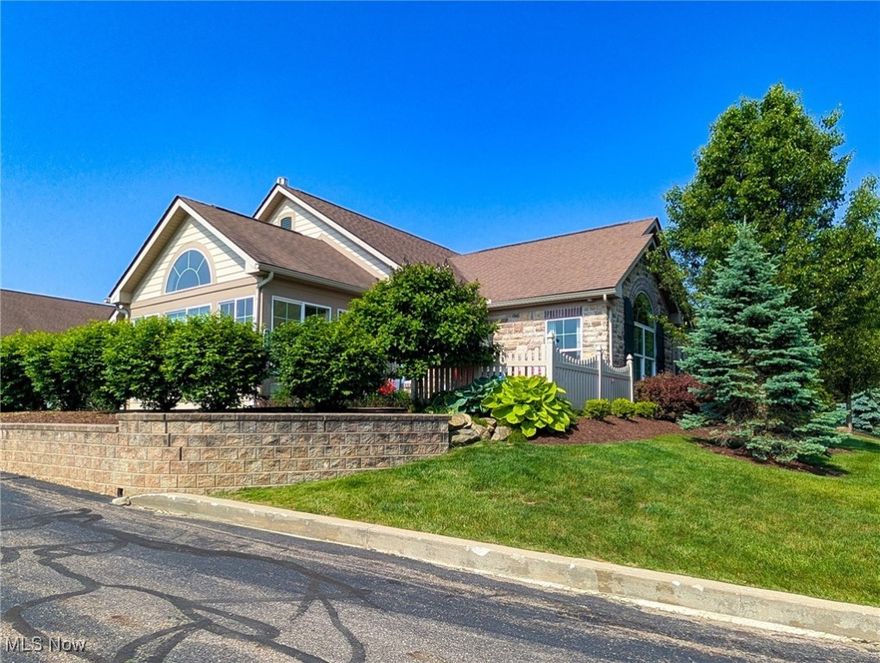 Beautiful and Impeccably maintained and updated 2 bedroom, 2 bathroom condo on one of the best lot in development. Next to Boulder Creek Golf Course. Welcome your guest through the private front porch and into the spacious living room with vaulted ceilings and a gas fireplace. The incredibly light filled sun room flows seamlessly front the living room. A GREAT place to relax and unwind. Amazing updates in this one floor living perfect condo in the heart of Streetsboro.  A few steps into the modern kitchen with granite counters and tiled backsplash, stainless appliances, high end fixtures. Beautiful and durable wide plank hickory engineered hardwood flooring throughout homes spans the living room, dining room, and sunroom.  2 Large bedrooms with both with walk in closets. The dedicated master suite also includes a private full bathroom.  The light filled sunroom is beautiful and a must see! The spacious laundry room features a walk in storage room. Attached  2 car garage, with storage above, is a clean dry and safe place for owner entry.Community Pool!  NEW FURNACE and AC in 2024. Close to restaurants, shopping,