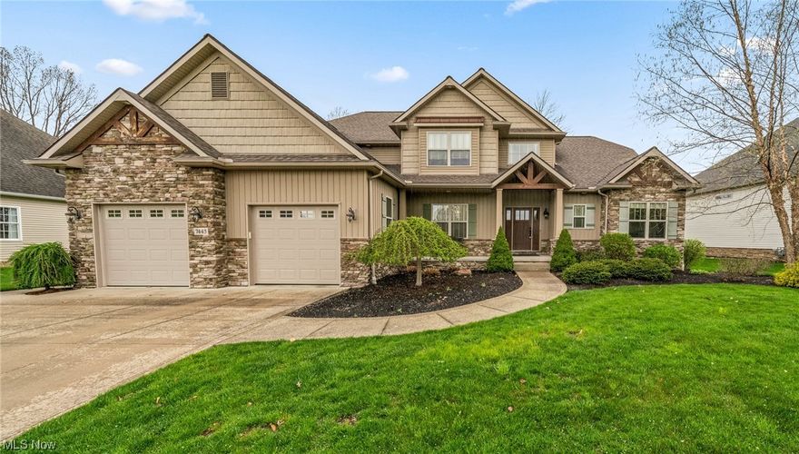 Craftsman style home with shake siding and plenty of charm! Enter the two-story foyer and formal dining room area with beautiful wood flooring. You'll love this gorgeous great room with stone fireplace and a wall of windows to enjoy the beautiful landscaping kept lush with a Rain Bird sprinkler system. Kitchen features rich maple cabinetry with granite countertops, tile, and stainless appliances with a walk-in pantry. Also includes a reverse osmosis water system. First floor private master suite has bathroom with double vanity, granite countertops, a jetted tub, custom shower, and walk-in closet. Second level has three bedrooms and a bathroom with private shower. Home also includes custom-made blinds, a tankless hot water tank, and a whole house generator. Outdoors you'll find a large patio equipped with a natural gas grill hook-up. Three car garage with cement driveway and Resnor heater. Located on a dead end cul-de-sac. Security system installed, but not monitored.