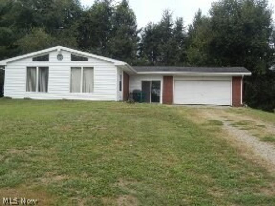 Home over-looking Ohio River. 230 feet waterfront on Ohio River. Very nice laying land.