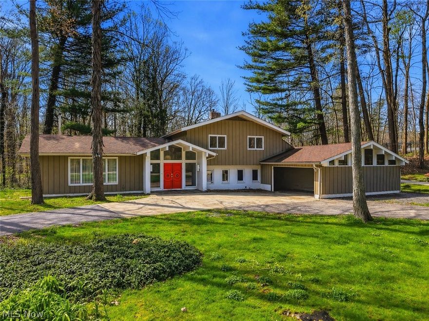 Pull up the horseshoe driveway and just sit for a second. Almost two acres of gently rolling land, mature trees, and the kind of quiet you don’t realize you’ve been missing. Filtered light, open sky, and a creek winds through the property. This isn't "that yard" with perfect landscaping think more of a Metro Park vibe that's all your own.
Vaulted ceilings, interesting roof lines, mid-century beams that architects would charge you a fortune to replicate today, a wood-burning stove, and rooms big enough to actually live in. The living room soars. The family room opens to the yard and there are panoramic tree views from most windows. Built in 1965, this is the real thing, genuine mid-century modern architecture at a moment when that aesthetic is genuinely hard to find. The vaulted ceilings and exposed beams weren't a trend then, and they're not a trend now. The best architecture just happens to age beautifully.
And here's the honest part: it needs some love. The updates haven't happened yet and THAT's the opportunity. One of the full bathrooms is waiting on repairs and your cosmetic touch before it's back in rotation. But the roof was replaced in 2017, a new well dug in 2016, the septic replaced in 2014 — so the expensive, invisible and important stuff is already handled. What's left is the fun part. Paint, fixtures, finishes. Your personal HGTV episode waiting to happen in Chagrin Falls schools. With Geauga County taxes. On a quiet street where the neighbors take their properties seriously. 
This home is waiting for your vision. The fixtures, the finishes, the colors, the flooring--consider this your canvas. And when the work is done, you will walk out onto nearly two acres and you'll understand the real masterpiece was never just inside the house. 
Andy Warhol said it best "Land really is the best art.” And that is what living in the Chagrin Valley reminds us of everyday.
Selling as-is.