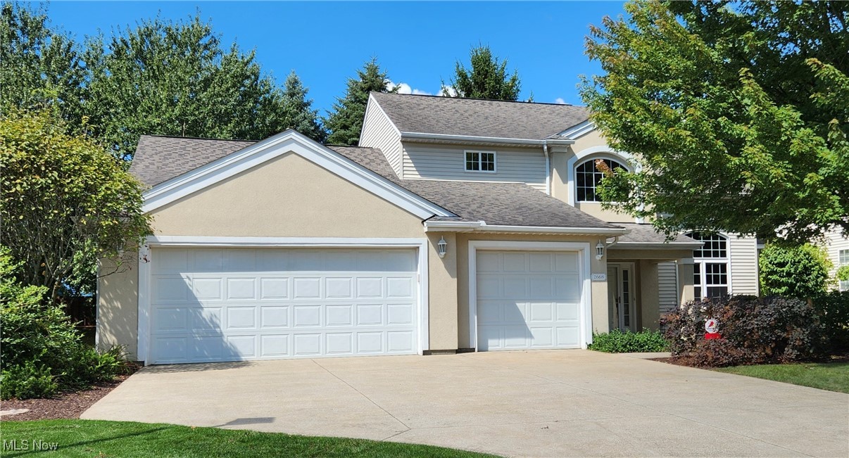 RARE FIND in Twinsburg! Younger FREESTANDING cluster home with a FIRST FLOOR PRIMARY SUITE AND A THREE CAR ATTACHED GARAGE. Covered front entry opens to the light filled vaulted great room and adjoining dining room. Oversized eat in kitchen has maple flooring, granite countertops, pantry cupboard and stainless appliances-refrigerator replaced 08/25 and dishwasher which has barely been used. Sliding door from kitchen opens to patio and wooded privacy w/ fencing behind. Primary suite has remodeled glass shower and soaking tub, double granite tops and newer backsplash, as well as a large walk in closet. Upstairs there are 2 additional bedrooms that share a bathroom with tile flooring and a granite double sink vanity. All newer windows on the first floor except window over the kitchen sink. First floor powder room completely remodeled with marble flooring and crown molding. Furnace has a newer circuit board and motor. Water pressure booster included! Added additional insulation in garage and attic. Garage temperature stays at 45/50 degrees in the winter time and has hot and cold water. New glass (2025) in upstairs bathroom. Exterior trim painted in 2024. First floor laundry room with washtub and cabinets. Hot water tank (2018) Kitchen, primary bathroom and powder room have 9 ft ceilings. Convenient water pressure booster included in the sale. Additional visitor paring across from home. Walk or bike to Liberty Park and Liberty Nature Center-less than one mile. Short drive to Glen Eagles Golf Course, Twinsburg Water Park and Twinsburg Recreation Center with indoor pool, track and all types of classes. Minutes to 2 grocery stores, shopping, freeway, medical facilities, schools, library & community gardens. Twinsburg is home to the world- famous Twins Day Festival. Summer concerts in the park. Exterior Point of Sale Compliant. Monthly maintenance fee of $170 includes landscaping and snow removal. TWO GUEST PARKING AREAS VERY CLOSE BY!