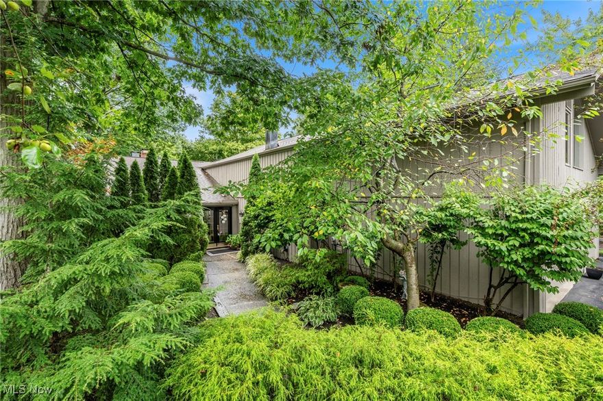 Here is your opportunity to own an entertainers dream home nestled among the trees in one of NE Ohio's premier golf and leisure communities. Morning coffee with the birds or an evening with friends around the natural gas fire pit are enhanced by the sheer beauty of nature that surrounds the expansive wrap around multilevel deck with lawn and ravine views. Enjoy the ease of gracious single floor living with the added benefit of 2 additional areas for guests or family. The main floor living/dining room is open, airy and quite light filled despite the tree canopy and so cozy with the gas/ wb fireplace and wet bar. A cheerful kitchen is a chef's delight with updated appliances, cabinets galore, walk-in pantry, solid surface counters, a casual eating area with patio sliders to an outdoor dining patio with retractable awning and a 2 natural gas hook ups for your bbq and smoker.  The master suite provides ample space for a private sitting/tv area, direct access to the deck, a sumptuous updated bath with soaking tub, walk-in shower and double walk-in closets. The 2nd br or home office with ensuite ba has built-in shelves and private patio. An updated guest 1/2 bath, laundry room and 3-car garage finish this level. The loft offers another sitting/tv/library area, 3rd br with ensuite bath and 2 incredible walk-in storage rooms.  The finished lower level provides wet bar, family room WB/G fireplace, the 4th br/full bath. Multiple sliders out to a patio and lawn. Gorgeous flowering perennial trees/shrubs/plants adorn the property.  The Walden Lifestyle includes a wonderful list of services like lawn/landscape maintenance and gutter cleaning included in your HOA fees. A tremendous list of big ticket updates is available.  Join Club Walden at an additional cost.  Membership optional but required to access amenities.