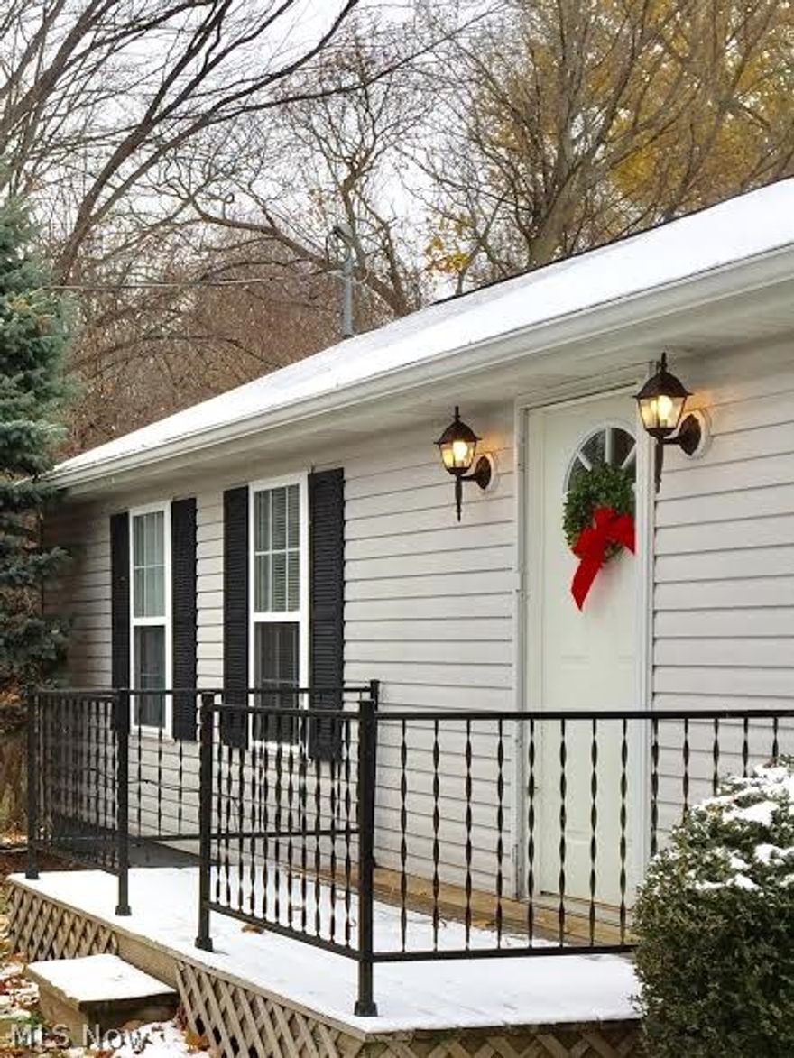 a half acre,  2 bed; 1 bath home with a deck and shed , Beautiful Out in the Country Living. all new plumbing; laminate flooring in great room and kitchen.  ; easy to show.  Just a few miles from Lake Erie; perfect for minimalist living in a beautiful country setting.
  home is right by the stop sign at darrow and barrows.  the west side of the home is a woodsy area.
no hustle and bustle of the city. SHOWS WONDERFULLY;  VAULTED CEILING IN KITCHEN AND LIVING ROOM. very light and airy.  no neighbors to the west. just a woods