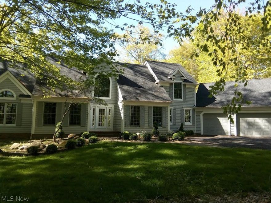 This lovely home has very special features. Enjoy the wow factor when you enter into a large inviting open room with a wall of windows with lush wooded views, soaring vaulted ceiling, skylights and FP. The home sits high above Silver Creek where there's a long majestic waterfall to see and hear after a storm! Sit on the deck and enjoy the sights and sounds in the serene and private setting on 5 acres that surround you. The open kitchen has a large island, eating area, all wood Merillat cabinets, Thermodor appliances, granite counters, skylights and gleaming wood floors. Walk out to the attached screened porch leading to the deck. The spacious first floor master bdrm suite is amazing with a 16x16 ft loft with skylights, a large bdrm with a door to the deck, 4 closets(2 are walk ins), 2 vanities, a shower & jetted tub, The first floor also has a formal DR, 1/2 bath, utility rm and an attractive office or bdrm. 2 bdrms with a Jack & Jill full bath are on the 2nd floor. Horseback and walki