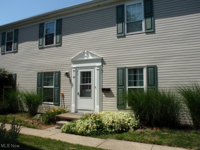 Clean as can be and move in ready. This is a second floor ranch condominium that has a private foyer entry with one staircase leading to the unit. Freshly painted and has windows all around for lots of natural light. It offers a large living room and good sized dining area with ceiling fan. The kitchen comes with stainless steel refrigerator, dishwasher, electric range and disposal. There is a breakfast bar with pendant lighting that is open to kitchen and living room. The master bedroom is generous sized and has a walk in closet. The 2nd bedroom is 11 x 11 and has a nice, large closet. Bathroom has a stackable washer/dryer behind the door so no trips to the laundromat. All of the appliances were purchased in 2018 as was the water tank and windows. The HVAC system 2020. There is a one car garage behind the unit and additional parking space. Easy access to I-90 and the Ohio Turnpike, grocery storage and shopping.