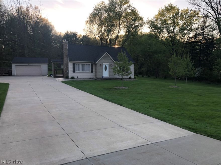 Fabulous updated 3 bedroom cape cod on 2+acres with 2 oversized garages one is insulated with AC/heat, Many updates to this home,  just to list a few like newer Roof, Newer Siding, Newer windows, 200 amp service, bathroom remodeled 5/2022, newer flooring, custom amish built cabinets in the kitchen. with a fabulous wrap around Cedar deck, stamped concrete patio, newer oversized concrete drive, large living room with wood burning fireplace, and so much more. This home is a must see. Perfect in every way, schedule a private showing today.