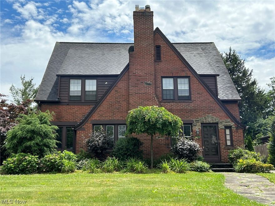 Handsome brick English colonial has many architectural details such built-ins, french doors, charming three season room with tiled floor. 
The sun-filled living room has a fireplace, hardwood floors and the sun room is next to living room offering a perfect place to read and relax. Enjoy family gatherings in the formal dining room which is graced with french doors and bay windows.  The kitchen has appliances, pantry, breakfast area and lots of storage.  The second floor has a total of four bedrooms which includes cozy nursery, the master has a decorative fireplace and lots of windows; and two additional big bedrooms with built-in features.  Third floor suite offers bedroom, sitting room and full bath.  The finished basement has a newer full bath, sitting area, storage, and laundry room.  Enjoy the unique and beautiful two-tierd backyard, private patio and two car garage.  Conveniently located in the Onaway district and close to historic Shaker Square which offers Saturday shopping at the Farmers Market...such a treat!