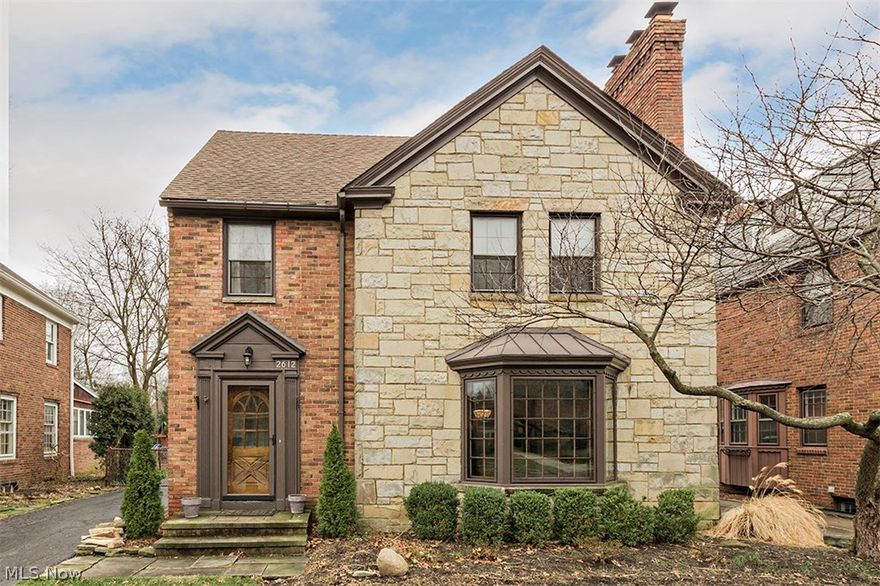 This is a WOW house! Sought after University Heights location! Stunning Brick and Stone Colonial that won MOST BEAUTIFUL HOME in in 2015, with loads of charm and updates. Natural daylight abounds in this home! Kitchen features granite counter tops and stainless steel appliances. Formal living room w/ pretty bay window, crown molding and fireplace; hardwood floors. Dining room w/ hardwood floors, crown molding, built in palladium door china cabinet!  Fabulous huge family room with gas fireplace and tons of built in cabinetry that overlooks beautifully landscaped yard . Three bedrooms on the second floor with full bath, Third floor suite w/ full bath, not included in square footage, great for an office or fourth bedroom. Lower level family room with fireplace, carpet and plenty of storage. Terrific location too, close to everything... a stroll to Fairmount Circle shops and restaurants. Convenient to Universities, shopping, dining, hospitals, downtown Cleveland and the Cultural district o