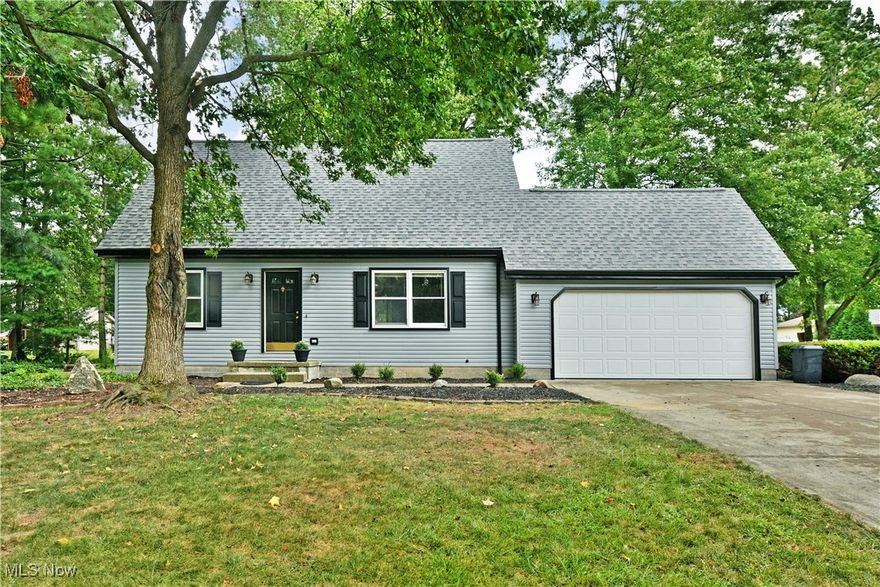 Welcome home to your summertime relaxation getaway as you kick back beneath the trees! This move-in-ready Cortland home should be at the top of your list with its great looks inside and out plus an impressive four-bedroom layout. The prime location puts you within a highly desirable neighborhood set along a quiet cul-de-sac style loop for minimal traffic. The terrific residence peers out from beneath the trees as you quickly note the bold red entry door and matching shutters. Beautifully manicured landscaping follows multiple mulch beds that lead around to find the must-see rear patio, ready to entertain in shady, natural privacy. Inside, a spacious living room sets the tone as hardwood styled flooring runs from the tiled foyer and carpeted staircase landing. Sunshine filters through the tall windows for plenty of natural light. Around the corner, the combined kitchen and eat-in dining space offers casual backyard views and a transition to the robust tiled flooring. Modern appliances pair with the marbled stone countertops, adding to the appeal. Down a short hall, a colorfully tiled full bath accompanies a pair of carpeted bedrooms to complete the floor. Upstairs, two additional loft rooms join a second full bath and its wraparound layout. Down below, a full basement offers laundry services and plenty of storage. Brand new roof, siding and gutters!
