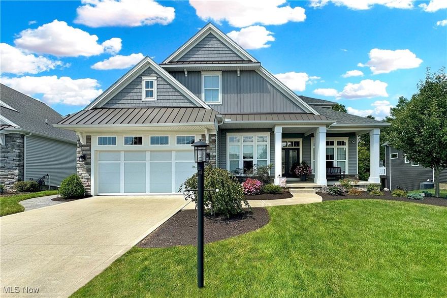 WELCOME TO YOUR DREAM HOME in the highly desired Village of Brecksville with limited maintenance. Enjoy this beautiful 4 bedroom 3.5 bath home situated on a picturesque premier wooded lot w/beautiful landscaping, a charming front porch with stone & metal roof accents, and a FINISHED WALKOUT lower level. This home was quality constructed w/today’s highly desired lifestyle features providing 1st floor living with a BRIGHT and OPEN floor plan. Soaring ceiling, wood floors, solid core doors, superb modern finishes and beautiful windows throughout. As you enter the home, you immediately appreciate the home’s OPENNESS and EXTENSIVE UPGRADES. Towering 10’ ceilings, dream kitchen w/an extended eating area. Great room overlooking the private treed lot w/full wall stone gas fireplace w/access to a private deck, 1st floor Laundry, 1/2 bath, private office, formal dining room and cubby/bench area w/access to garage. Relax in your beautiful 1st floor vaulted owner suite w/tray ceiling, 2 walk-in closets, gorgeous bath w/large custom tile/glass shower, free standing tub, dual vanities w/quartz countertop and a makeup area. Elegant spindle rail staircase leads to the 2nd floor level with a large loft overlooking the great room & foyer, 2 bedrooms and a full bath. Sensational finished walkout lower level w/9ft ceilings extends the OPEN living space w/large rec area, custom bar w/granite, 4th bedroom/flex room & adjacent full bath. Perfect for guests with access to the spacious beautiful stamped concrete patio with fire pit perfect for outdoor gatherings. Brecksville has an exceptional community recreation complex, highly rated school system, near the major highways/Turnpike, golfing, shopping, and The Cuyahoga National Valley Park where hiking, biking and skiing are within minutes.