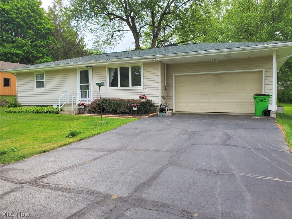 Meticulously maintained 2 bedroom ranch in Tallmadge! This home offers the nicest screened in porch to enjoy the seasons and birds (listed as "other" on room features). Great closet space in both bedrooms and plenty of storage in bathroom and kitchen (appliances convey). Enjoy the recreation room complete with a mini kitchen - again lots of cabinet and counter space, sink and gas hookup for a stove if desired. Nice workbench and shelving for storage in the unfinished space. Nice attached 2 car garage plus a shed in the awesome, flat backyard. There's even a patio for cookouts this summer. Updates include new roof, stainless steel refrigerator, and screens in porch - 2020. New front and storm door - 2019. Home warranty provided for peace of mind.