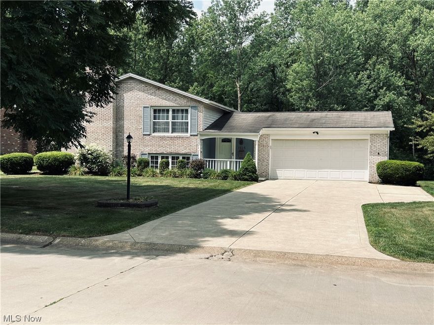 Brick Four bedroom split level featuring First floor full bath with granite counter tops.  Front door foyer leads up steps to the nice size living room, eat in kitchen with granite counter top and plenty of cabinets along with dishwasher, stove, refrigerator and  laminate flooring. The lower level features a large living room w/wood burning fireplace for entertainment, half bath and master bedroom  with carpet and windows,  laundry room/basement vinyl tiles,  new hot water tank and water softener, plus a Radon system.  The foyer hallway leads to an enclosed porch w/carpet, windows and patio doors out to  concrete patio.
This gorgeous home is a must to see with large back yard, two car garage with shelving and concrete drive way with plenty of parking.