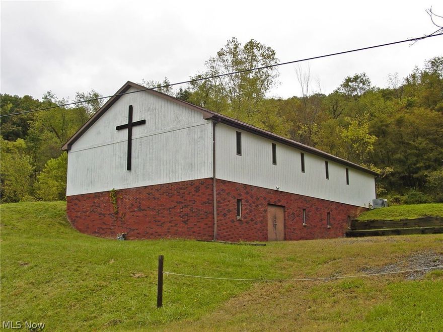 A must see! Currently a church but could be converted to offices, banquet hall or so much more. The possibilities are endless! Outside the city limits. Approximately 4554 Sq. Ft. on two floors. Full finished walk out basement with kitchen. Stove and fridge stay. Two sets of bathrooms. Roof & A/C 5 yrs., and hot water tank brand new per seller. Need to see to get your ideas flowing!