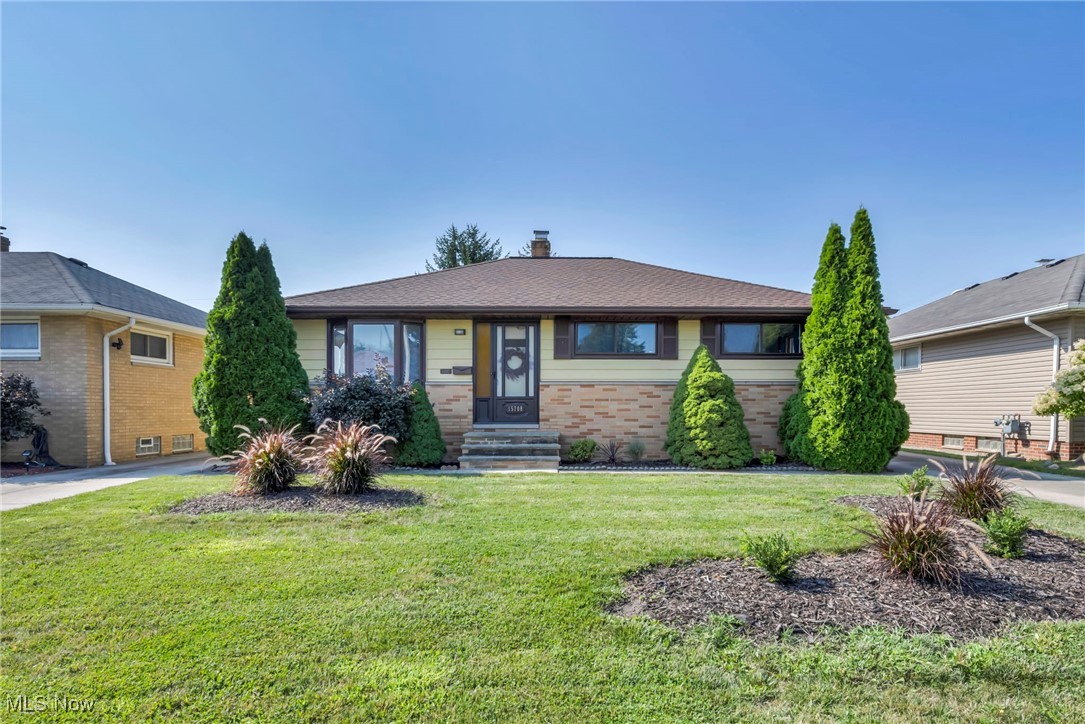 Enjoy easy, single-level living in this updated ranch, set on a beautifully landscaped lot with timeless curb appeal.  Come on in to your spacious living room that seamlessly connects to the dining area. Recently installed Luxury Vinyl Plank flooring adds style and durability, while the dining room opens to a covered back patio — perfect for summer entertaining or morning coffee.The kitchen includes all appliances, ready for your next culinary creation. Down the hall, you'll find three bedrooms with newer carpet and fresh paint, plus a full bath. The primary bedroom features a private half bath for added convenience. The finished lower level offers a freshly updated rec room, laundry, and a versatile utility area with storage potential. Major updates completed in 2025 include a new furnace, A/C, hot water tank, and upgraded electric service with new mast & breaker panel — giving you peace of mind for years to come.  Opportunities like this don’t last long — see it before it’s gone!