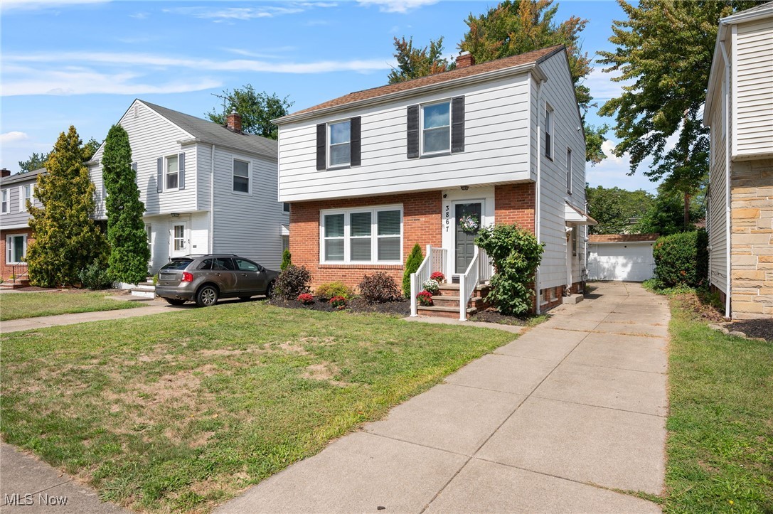 Built in the 1950s, this South Euclid home blends timeless character with modern updates on a park-like lot. Offering 3 bedrooms and two and one half baths, the layout includes a full bath upstairs with the bedrooms, a half bath on the main level, and an additional full bath in the finished lower level. The kitchen is equipped with stainless steel appliances, a breakfast nook, and a separate dining area for larger meals. A bright sunroom overlooks the spacious yard, while the finished basement area provides extra living space and laundry. A detached garage adds convenience and storage. Additional features include fresh paint (2021), kitchen sink garbage disposal, hot water tank (2020), hard wood floors, cedar closet.