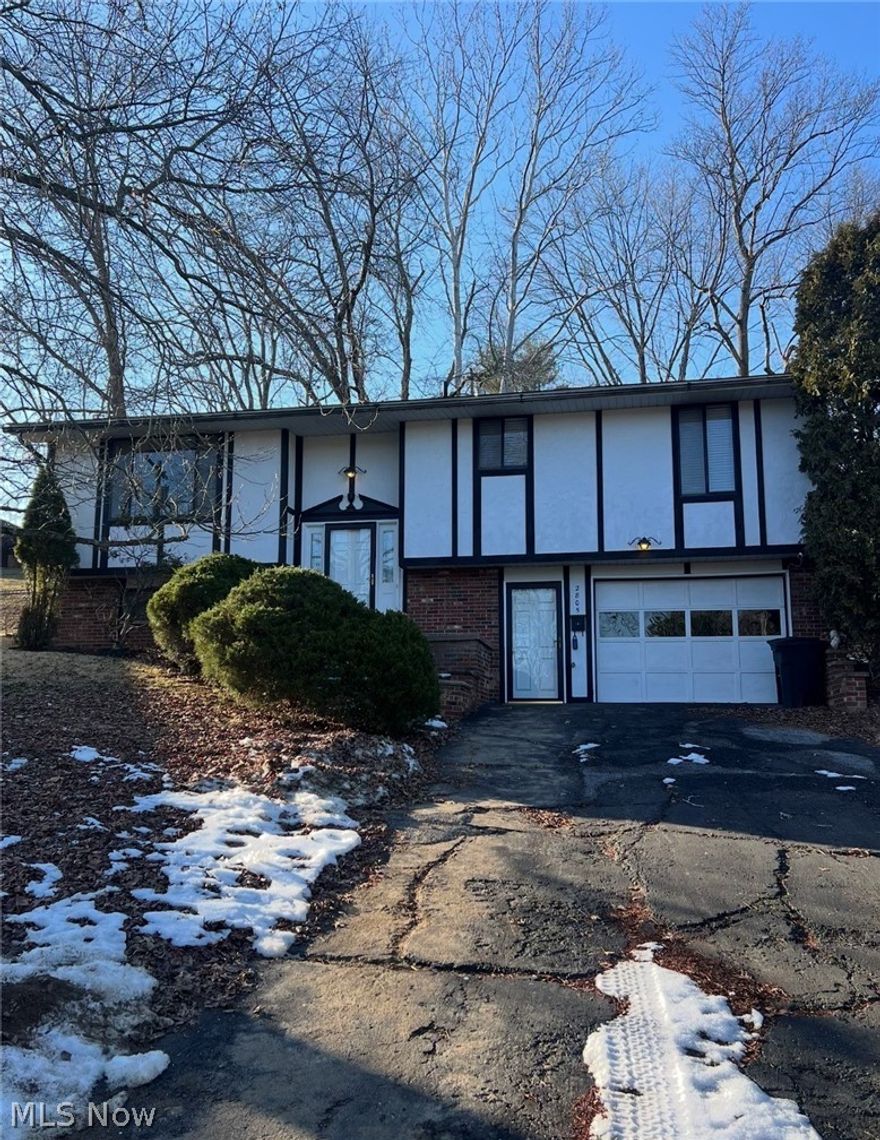 This well maintained move in ready split foyer home offers 4 Bedrooms and 2.5 baths, which includes a primary suite with full bath. The kitchen has been updated with newly painted cabinets, updated sink, and stainless steel appliances. You will find newly installed carpet on the homes lower level, and ceramic tile flooring extending from the home office mudroom and attached garage entrance. A spacious laundry room, brick fireplace and large 4th bedroom are all pleasant surprises on the homes lower level. The home has central air, forced air heat and gas along with a real wood burning fireplace for those cool Autumn and Winter months. The home also has a newly updated electrical system. The heated and cooled attached garage makes coming home comfortable and outdoor garage work a breeze. If you work from home or run your own business from home don't forget to check out the home office with its own private front entrance. This lot boast plenty of lush greenery and landscaping allowing for privacy, the back deck right off the kitchen and dining has plenty of space for entertaining, the home also boast a partially fenced yard. This home is located within walking distance to the Parkersburg City Park and is located within minutes to Grand Central Avenue/(Grand Central Mall) and WVU Medical Center, convenient to all amenities, and conveniently located to I-77 and Route 50 just a short 4 minute drive for commuting and travel.  Schedule a visit today to see this beautiful Morningside Avenue home and all it has to offer. 1 YEAR HOME WARRANY INCLUDED