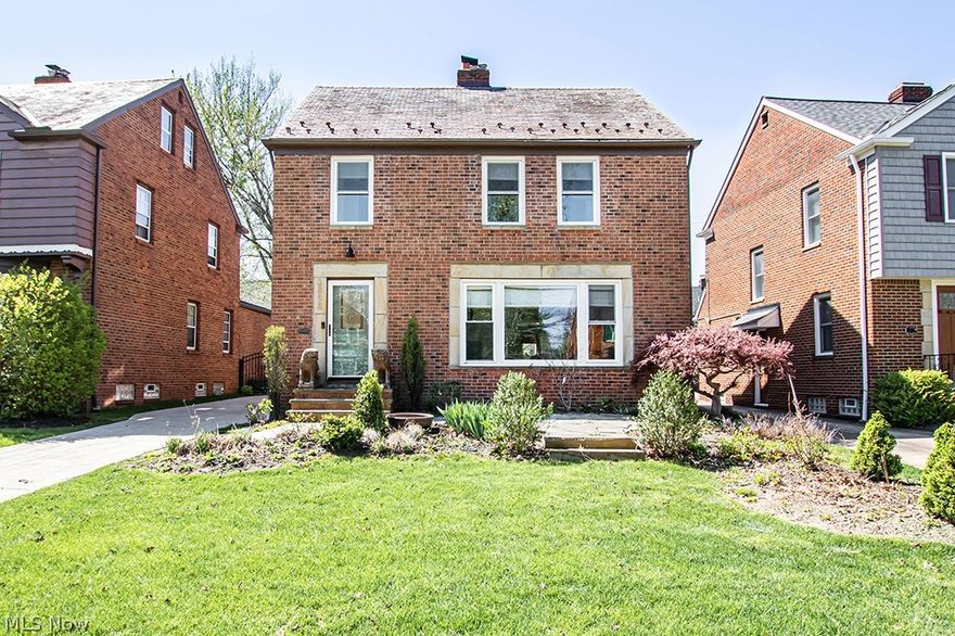 Come fall in love w/ this gorgeous colonial home! Past the lovely brick exterior w/ unique stone framing, you'll find an incredible interior, meticulously updated w/ modern amenities & full of pride of ownership. It offers everything you & your family will need! The bright living features a fireplace w/ mantel & unique tile accents & flows easily to the large dining room & open plan kitchen. This fully renovated kitchen is a cook's dream: tons of storage in beautiful white cabinetry, custom kitchen island, wrap around countertops, stainless steel appliances (including convenient dishwasher drawers by the sink), stylish tile backsplash & so much more! There is a custom powder room at the side entrance & huge rear family w/ built-in cabinets that are perfect for additional kitchen storage or a home office & custom built-in locker storage great for the kids' or mudroom items! Upstairs, there's even more space w/ 3 bedrooms on the 2nd floor, an updated full bath w/ double sink vanity & til