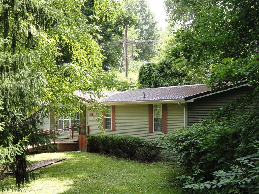Rare find within city limits.  Totally remodeled 3 BR, 2 Bath Double-wide on 0.47 Acres in a park like setting w/small stream on property (3 more lots are available at an additional cost).  Some 2018 updates include all new lighting fixtures, new plumbing & fixtures installed.  New metal roof June 2018.  Close to all amenities, PA/OH borders, State Park, Beaver Cracker plant & more.  HOME WARRANTY INCLUDED.