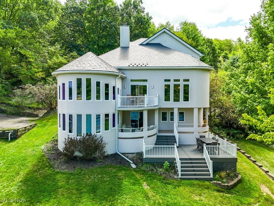 This stunning contemporary lake house perfectly blends modern design with practical amenities, fully furnished, offering the ultimate in lakefront living. The home features an oversized garage with ample space for multiple vehicles, boats, and recreational equipment, along with extensive storage throughout, including walk in closets and a lower-level garage. The open-concept living area is both sleek and inviting, seamlessly connecting the living, dining, and kitchen spaces. Two stylish fireplaces, located in the living room and basement, add warmth and ambiance, making this home ideal for both relaxation and entertaining. The kitchen is a chef's dream, boasting ample counter space and a large island. Outside, the spacious deck and patio provide the perfect setting for outdoor dining and enjoying the serene lake views. Lake Mohawk is a private gated community with an unlimited horsepower 500 acre lake, 3 beaches, an executive 9 hole golf course with a separate membership, tennis/pickleball courts, clubhouse, and much more! All docks and jet skis are available for purchase.