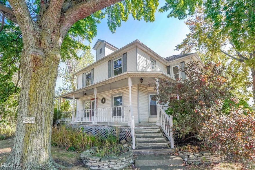 This side by side farmhouse duplex is full of charm and opportunity! Whether you're looking for multi-family living, rental income to offset your mortgage, or a solid investment, this home has you covered. Both separately metered units are filled with character, featuring original woodwork, archways, and hardwood flooring. A wonderful wraparound porch offers the perfect spot to enjoy the summer breeze. Inside, each unit includes an updated kitchen, a modern bathroom, and two comfortable bedrooms. The divided basement provides storage space for each unit, along with separate laundry hookups for added convenience. Set on a beautifully landscaped half-acre lot, there's plenty of room for gardening, plus a fenced yard where kids and pets can play. Don't miss this rare find, call today!