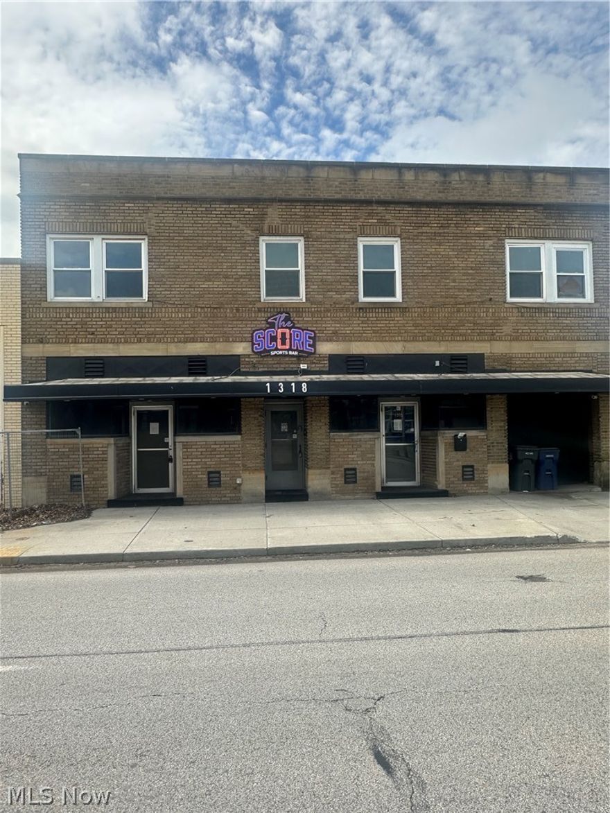 Fabulous opportunity for this mixed use property. Full.y functional and ready to operate kitchen that was formerly a bar. Lots of potential with a game room, space for a band and dance floor. Two (1 br) apartments (approx 740 sq ft) and Two efficiences (approx 660 sq ft)above the space. Full basement. 4 garage spaces plus driveway & street parking.