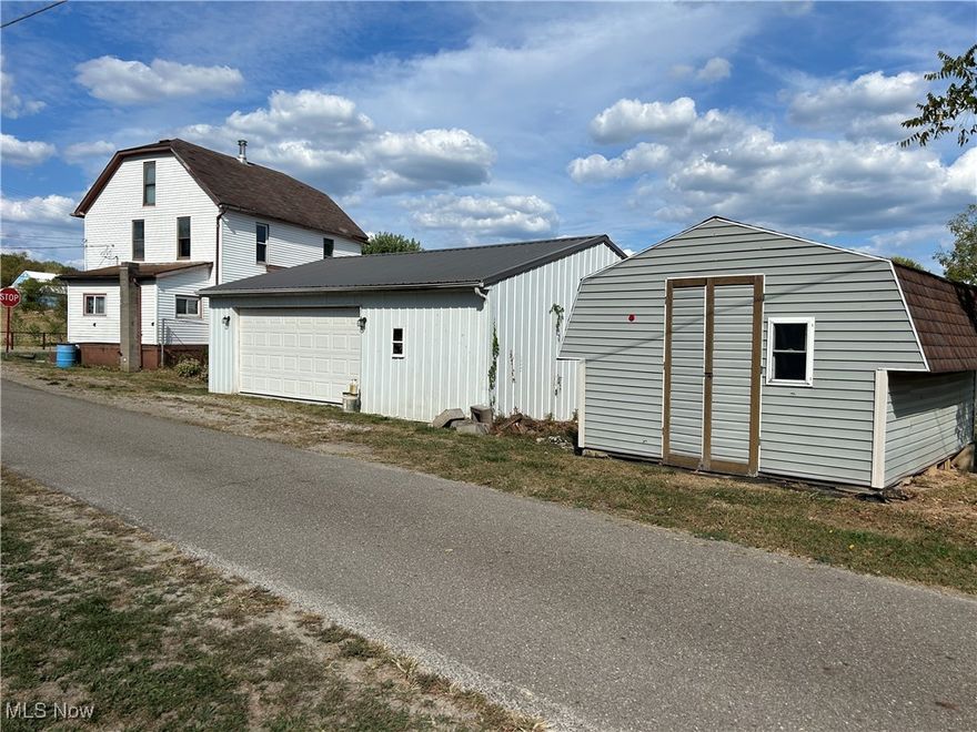 Put your own touch into this house to make it your home. Enter into the enclosed porch/mudroom and into the large kitchen with lots of cabinet space and pantry. First floor also includes dining room, living/family room, full bath, and bedroom. Second floor features 3 bedrooms with finished wood floors, and large open hallway. 3rd floor has plenty of room to finish for an office, rec room or provide storage. The detached 24 x 30 garage has a concrete floor, 2 garage doors, and extra room to work. The large level yard is enclosed with chain link fence for your pets and/or garden. Property also includes 2 other storage buildings to store your tools and accessories. Property is being sold as-is.