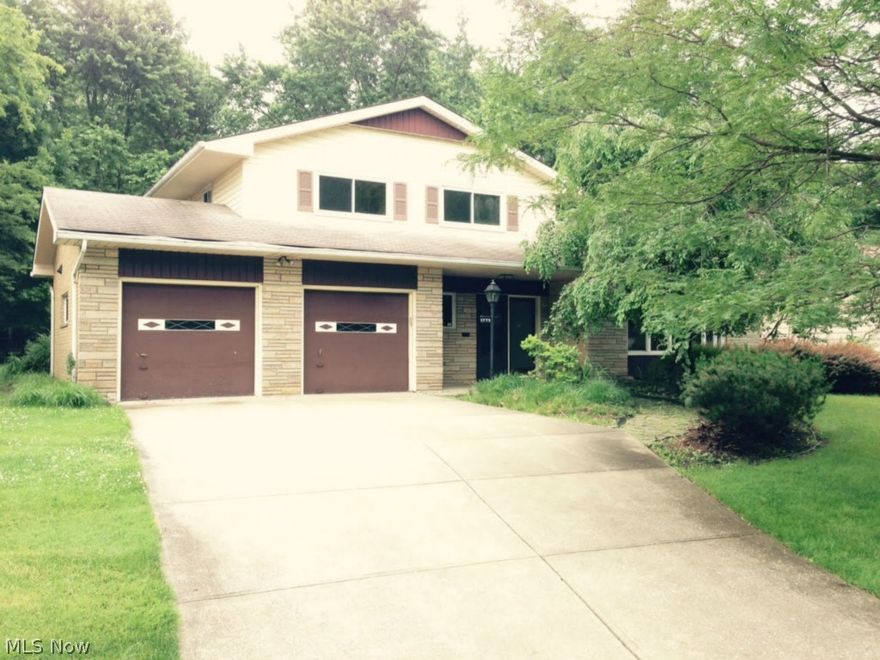 Awesome split level home with three bedrooms.  Step up from the spacious living room with brick fireplace into the formal dining room, kitchen and family room! Two car attached garage!  Pretty lot!  Nice curb appeal!  This is a Fannie Mae HomePath property.  All information is approximate.