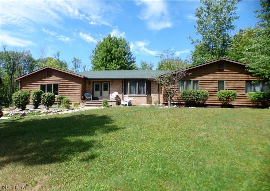 Sprawling Ranch on Almost 6 Beautiful Acres in Concord Township!  With over 3,000 sq ft of living, this home has over-sized rooms and doorways throughout and a basement that can be finished to add additional space.  Cozy up next to the wood burning fireplace in the great room and prepare dinner in your kitchen with slate floors and tons of cabinets and counter space.The 3 seasons sun room leads out onto the deck (with built in grill) and overlooks the lovely wooded lot.  Updates include: Roof, HWT and AC.  Save on heating bills with the furnace that is powered by gas or wood from your backyard forest. Truly a nature lovers dream! Call for your appointment today!