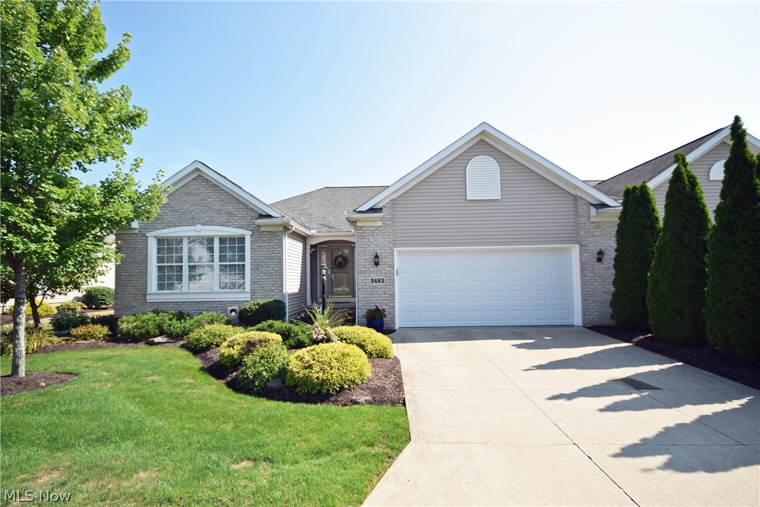 Well maintained like new custom-built cluster home on Mayfair Country Club 17th green! Beautifully well lit open floor plan! The large cherry kitchen featuring granite counter-tops, fully applianced with new stainless steel appliances, hardwood floors, vaulted ceiling with skylights and patio door off the dining room with great views of the golf course and water. A SunAir awning (electric) is included to shade the patio room on sunny days along with a natural gas hook-up for grilling. The great room features a gas log fireplace and vaulted ceiling with views of the golf course. There is lots of natural light from the large windows and skylights. The master bedroom offers a glamour bath including upgraded whirlpool tub and walk-in closet. The third bedroom has french doors and is presently used as an office. Each room has a ceiling fan, custom blinds and window treatments and double paned storm windows throughout. There is a full yard sprinkler system included to water the fully la