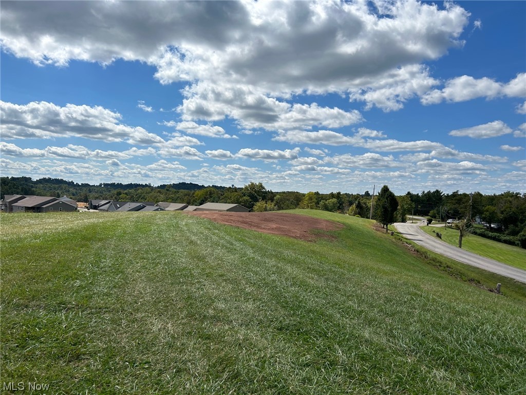 Property was recently surveyed and part of Tax Parcel 340067435033. Consisting of 1.915 acres, beautiful building lot only 10 minutes from Marietta or 20 minutes from Belpre/Parkersburg. Surrounded by several new built homes. Gas, water, electric, and hi-speed internet available. Some deed restrictions apply. Taxes will have to be reassessed.