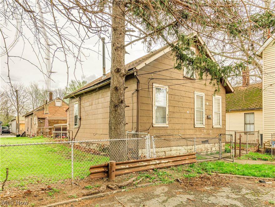 Unlock the potential with this unique investment opportunity featuring two single-family homes on one lot that's perfect for expanding your portfolio or generating multiple streams of income! The first home is tenant-occupied with a long-term resident of 20 years, currently paying $700/month, offering immediate and consistent cash flow. The second home is ready for your vision and needs some work to make rent ready. Whether you're a seasoned investor or just getting started, this property offers strong upside potential and built-in income from day one. BUYERS, contact your own Realtor for inquires, showings and to make an offer. No Wholesalers, NO contract assignments and NO seller financing. Seller does NOT have any additional information regarding this property. Being sold AS-IS. Seller will NOT make any repairs. Conveniently located near Downtown Cleveland & I-77.