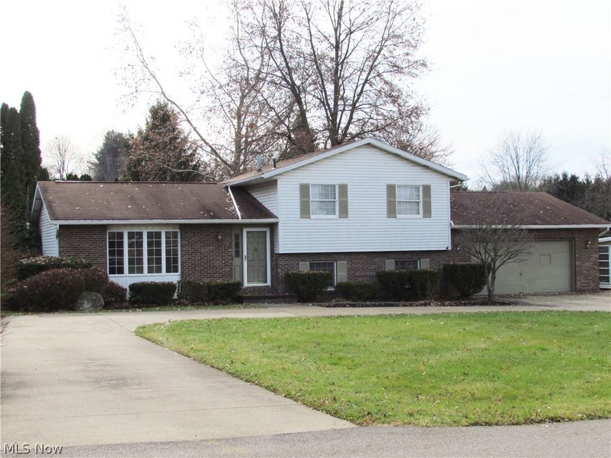 Well cared for four-bedroom, two-full bath home in top rated Lake School District! This home sets in desirable Emerald Hills Subdivision, within walking distance to Uniontown Elementary, and close proximity to local markets, downtown Hartville with all it has to offer, and quick access to I-77 Akron/Canton. Resting on nearly a half-acre lot which offers concrete pull through drive with additional parking area, nice private back yard with a newer 2 car outbuilding w/ concrete floor and electric (plus two car attached garage) and attractive curb appeal. Excellent floor plan with formal dining room, living room, family room with fireplace and a neat three season room off the back of the house. Owner has done many updates in the last few years including; new high efficient furnace and A/C 2016', new hot water heater 2013', new dishwasher and flooring 2016/2017',  new counter tops, new electric panel 2007' and fresh paint. Clean & move in ready. Schedule your showing today!