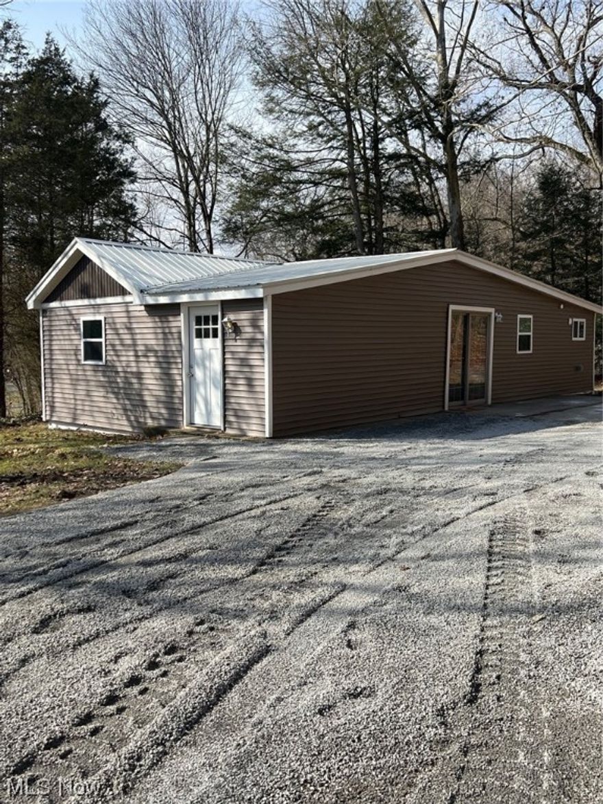 Tucked away on one and a half acres... this one story two bedroom home has been totally renovated and is ready for a new owner!  Freshly painted throughout,  new kitchen cabinets, countertops, Kohler stainless steel sink, lighting, flooring, plumbing and 200 amp electrical service. New metal roof, siding and soffit. Open floor plan ...living room, dining area, spacious entry, first floor laundry and partial basement. Come take a look!