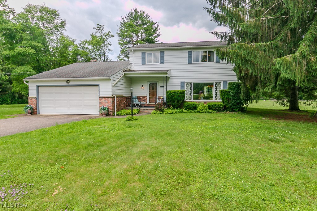 Wonderful original owner colonial ready for a new generation to make this their home. The 5 acre property backs up to the golf course & is wooded for privacy. The brick & sided home was built for a family with a huge spacious living room & dining room with gleaming HDWD floors & expansive windows overlooking the property. The cozy kitchen has maple cabinetry, lots of counter space & all appliances opening to an eating area. The family room has parquet floors & a brick facade on a WBFP for chilly Geauga county nights. The lovely 3 season room overlooks the serene backyard so you can watch the livestock of your choice. A 1st floor laundry room & a full bath with shower complete the main floor. On the 2nd floor there are 3 nice size bedrooms & the Master BDRM with 2 closets. The main bath has a tub/shower & big vanity.
The basement has a nice finished recreation area & another area with a workbench & mechanicals. Roof, septic, mechanicals updated . The barn is great for your 4H animals, Salt & Pepper, the heifers do not come with the property. Fence around the pasture is electrified. This home was lovingly built to last, with some cosmetic updating you can enjoy all this pastoral setting on a quiet cul de sac street has to offer. Close to historic Chardon Square, Burton Village, and so much more in Geauga County. Come home to the country, close to everything!