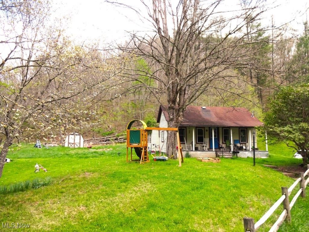 Home has NEW SHINGLE ROOF, newer HOT WATER TANK, AERATOR SEPTIC SYSTEM, BREAKER BOX & ELECTRICAL ENTRANCE, INSULATED WINDOWS. Excellent retreat, older partially remodeled home. Mostly level yard. Approximately 2 acres open land, other acreage is wooded. Nice convenient country home, 50+ acres deeded (38 AC surveyed) . 3 bedrooms, 1 bath. Kitchen/dining combo, living room, bathroom, utility room. Welcoming front porch, level yard, small stream on property. 10x12 outbuilding, off street parking. Easy access. City water, sewer. Living room bead board ceiling. Excellent hunting for deer, turkey, squirrels, raccoons, other wildlife. Come enjoy the peace and quiet and enjoy the moon and stars at night. 9 miles to Spencer, Wal-mart, grocery stores, building supplies, local fire department, Roane General Hospital, first responders. Also, short drive to Charles Fork Lake for fishing and canoeing.Fire Hydrant approx. 300 ft. Contact listing agent for details.