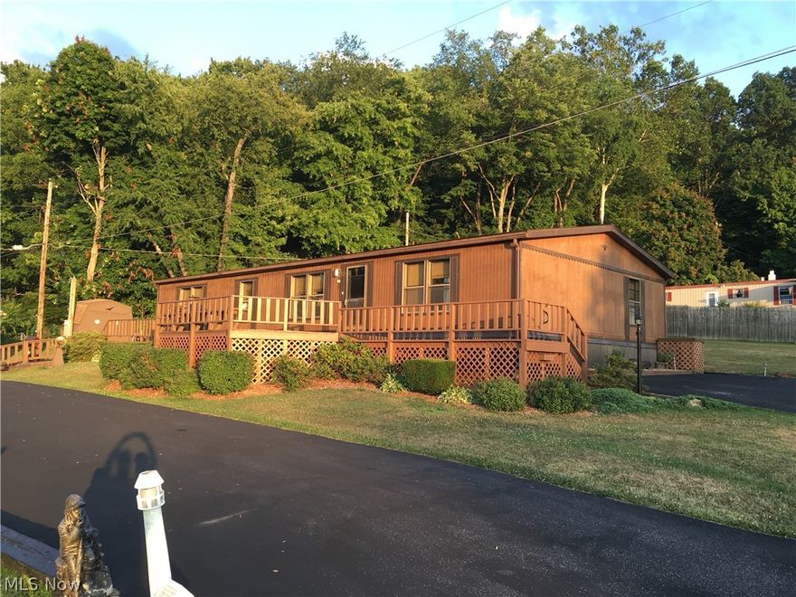 Great 3 bedroom 2 bath ranch style home close to the lake on private ground!  Master suite includes full bath and walk in closet.  Large open living room and dining room.  Large deck running the length of the home.  2 car detached garage/workshop w/woodburner & furnace (no fuel hookup).  Black top driveway sealed in 2015.  House roof 2011'.  All situated on 123'x120' lot.