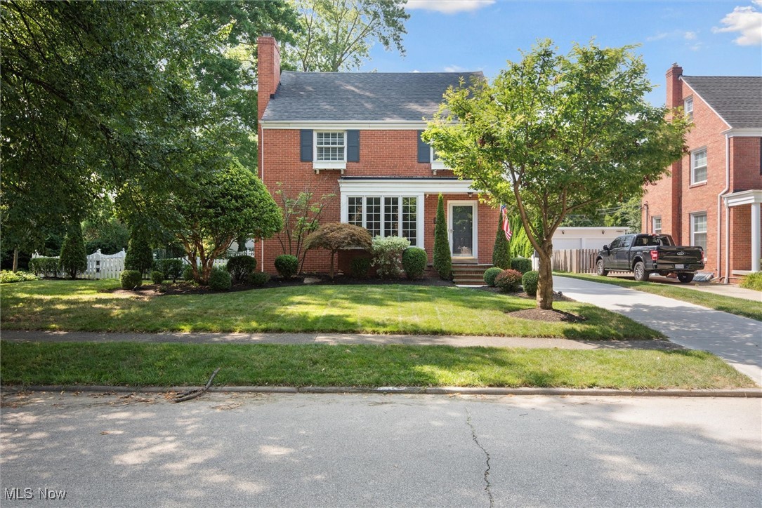 This all-brick 3-bedroom, 1.5-bath beauty sits on an extra-wide lot in one of Fairview Park’s most sought-after neighborhoods. From the moment you step inside, you’ll be greeted by gleaming original hardwood floors and thoughtful designer touches that perfectly complement the home’s fresh, neutral palette. The sun-drenched living room features a striking river stone fireplace and a bay window with built-in seating, creating the perfect spot to relax and enjoy the view. In the formal dining room, built-in china cabinets, a tray ceiling lead to the remodeled kitchen, which is a true showstopper! This beautiful kitchen is complete with a marble backsplash, granite countertops, and a built-in refreshment center with sink, wine rack, and glass-front cabinets. An adjoining eat-in area flows into a family room, highlighted by wood beams and whitewashed brick. A stylish half bath with a teak-and-stone sink rounds out the main floor. Upstairs, you’ll find three spacious bedrooms and a walk-up attic ready to be finished into your dream space. The primary bedroom easily fits a king-sized bed, offers two closets, and even has room for a vanity. The finished basement offers yet another fireplace, garden-style windows that bathe the space in natural light, a dedicated office area, laundry room, and ample storage. Outside, enjoy a new driveway and patio complete with fire pit, lush landscaping, a two-car garage with a 220V hookup for an electric vehicle and an Invisible Fence brand electric fence for your four-legged family members. This is the perfect blend of timeless character and modern updates—all in an unbeatable location. Schedule your private showing today and experience why Coffinberry living is so special!