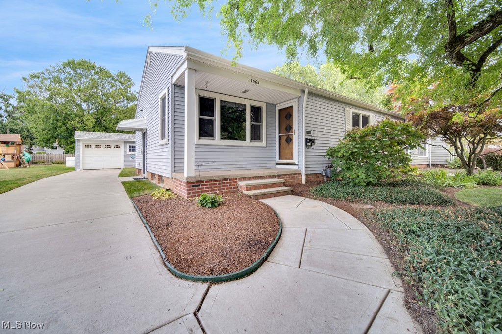 The best maintained ranch in North Olmsted is now for sale! If you want a beautiful home that is move in ready, you have found it! This home was loved by the same family since 1966!!! The front porch is full of charm and peace. The living room is warm and inviting with a large bay window and leads to the dining room. The kitchen has a neutral paint pallet with a gorgeous backsplash in with tall cabinets and granite countertops. All the appliances stay. Off of the dining room you will find a bonus room with bright lighting, that was used as an in law suite with an extra large, handicap accessible full bath, added in 1996. Three bedrooms and a full bath finish up the first floor. In the basement you will find Nature stone flooring by the mechanicals and a crawl space that flows under the addition. The partially finished basement has a bar/countertop area for entertaining with brand new carpet. Outside you will find a fully fenced in yard with a gorgeous garden area. The garage has nature stone and electric with a paved driveway. New roof and gutters and cap metal on garage 2022. Anderson Windows less than 10 years old. The attic is a walk up attic just off the kitchen area. Close to Schools, shopping and highways. Your serenity begins right here. Call to schedule today!!!