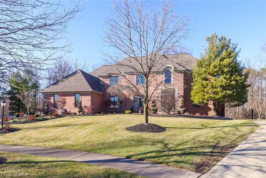 Architectural character is abundant in this stunning home built by Parkview Builders.  Situated on a beautifully landscaped cul-de-sac lot offering a lush, wooded view. The quality of the home can be seen upon entering the open 2 story Foyer. Features include solid wood doors, trim, crown molding & cabinets throughout the home.  The study has multiple entry through 2 different sets of French doors.  Soaring windows & a floor to ceiling brick gas fireplace grace the Family Rm.  The perfectly laid out eat-in kitchen features granite counters, breakfast island, abundant cabinetry, vaulted ceiling & access to the deck.  The 1st floor Master Suite features a tray ceiling in the bedroom and your own private deck.  The luxury bath includes a jetted soaking tub with a separate shower, walk in closet & vaulted ceiling.  This home boasts 3 additional bedrooms & 2 full baths on the 2nd level.  There are 2 staircases to the upper level & 2 to the lower level.  The finished lower level includes an