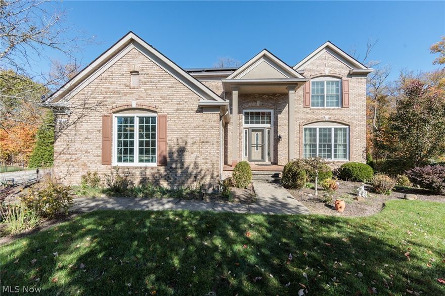 Welcome to this beautifully maintained Colonial tucked on a quiet cul-de-sac in the desirable Devonshire Woods community. Set on a picturesque wooded lot, this property offers a peaceful setting with mature trees, inviting outdoor spaces, and a private fenced in-ground pool perfect for summer gatherings.

Step inside to a bright two-story foyer with gleaming hardwood floors and an elegant staircase that immediately sets a warm, welcoming tone. The main level offers multiple living and entertaining spaces including a spacious living room filled with natural light and a comfortable family room featuring built-in shelving and a cozy fireplace. The eat-in kitchen is designed for both everyday living and hosting, showcasing granite countertops, abundant cabinetry, a large island with seating, and a sunny breakfast area surrounded by windows and plantation shutters. A formal dining area provides additional space for gatherings.

Upstairs, the primary suite offers a relaxing retreat with a generous walk-in closet and a well-appointed bath featuring double sinks, granite counters, a soaking tub, and separate tiled shower. Additional bedrooms provide comfortable accommodations and flexibility for a variety of needs, along with convenient second-floor laundry.

The walk-out lower level adds even more versatile living space with a recreation area, workshop space, and room for hobbies or fitness. Outside, enjoy a spacious deck overlooking the wooded yard, a patio area, and the fenced pool—creating a backyard designed for relaxing and entertaining.

Additional highlights include a two-car attached garage, lawn sprinkler system, garden areas, double-pane windows, and solar roof panels for added efficiency. A wonderful opportunity to enjoy space, comfort, and scenic surroundings in a sought-after neighborhood setting.