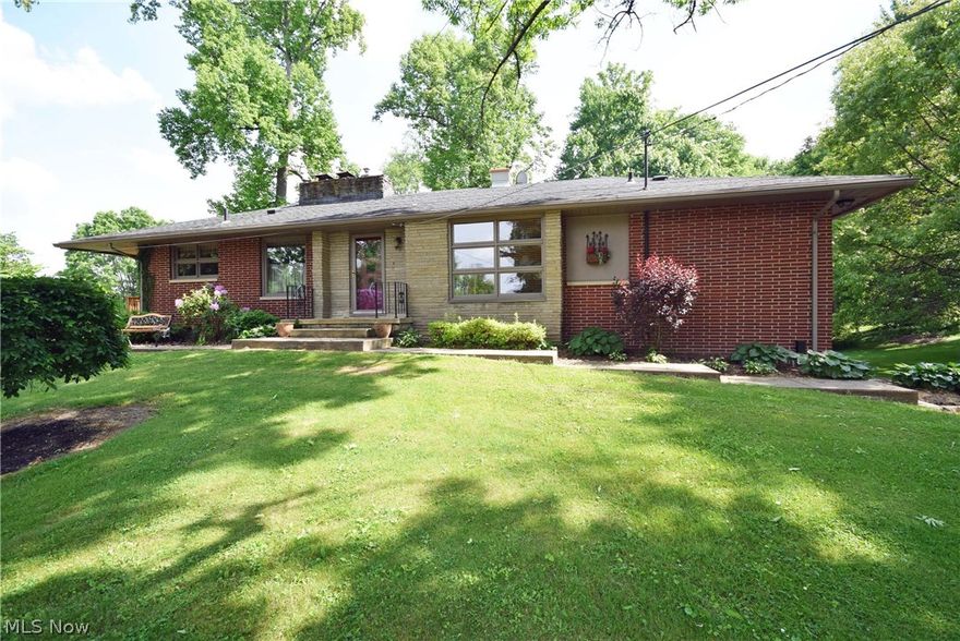 Check out this spacious ranch, walk-out lower level with in-law suite! You won't find a more perfect and private setting on just under an acre in Green. 3 car garage with 2 car garage attached and over sized 1 car garage detached. Beautifully landscaped with a gorgeous waterfall into Koi pond in the backyard by the stamped concrete patio. Spacious deck on the left side of the house with great views. Large great room with floor to ceiling picture windows to the backyard, double-sided fireplace which also opens to the dining room. 3 bedrooms upstairs include the master suite with master bathroom and double closets. Lower level includes the 4th bedroom which is part of the in-law suite. In-law suite also includes full bathroom, kitchenette, laundry, small dining area and a good sized living room with wood burning fireplace.  Bedroom and living room in the lower lever are above grade and living room has large patio door to the backyard. Meticulously maintained! You can't check this one out
