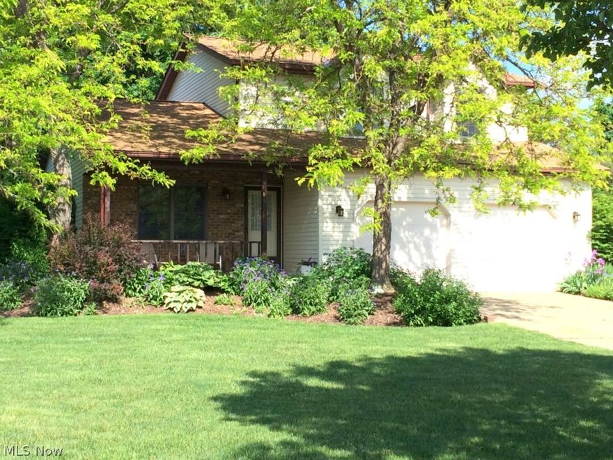 Welcome home to this Fantastic colonial in the Heart of Mentor. This home has almost 2,000 sq ft of living space and is situated on a beautifully landscaped   lot! The covered front porch is a relaxing way to end your day. The Living Room and Dining Room have vaulted ceilings. Continue  into the eat-in kitchen boasting oak cabinetry, granite counter tops, newer appliances and beautiful Brazilian teak flooring, with plenty of counter space. Enjoy the Family Room with wood burning fireplace with blower, With beautiful french doors that led out to the backyard patio, great for relaxing, and entertaining. The large 2nd floor Master Suite boasts a walk-in closet and a private Bathroom featuring his and her sinks & ceramic title floors. Two more bedrooms up with another large full bath, also with ceramic title.  The large basement recreation room adds additional space with tile flooring. The attached 2 gar garage is heated and has running water.
Roof was replaced in 2013.  Hot water tank is