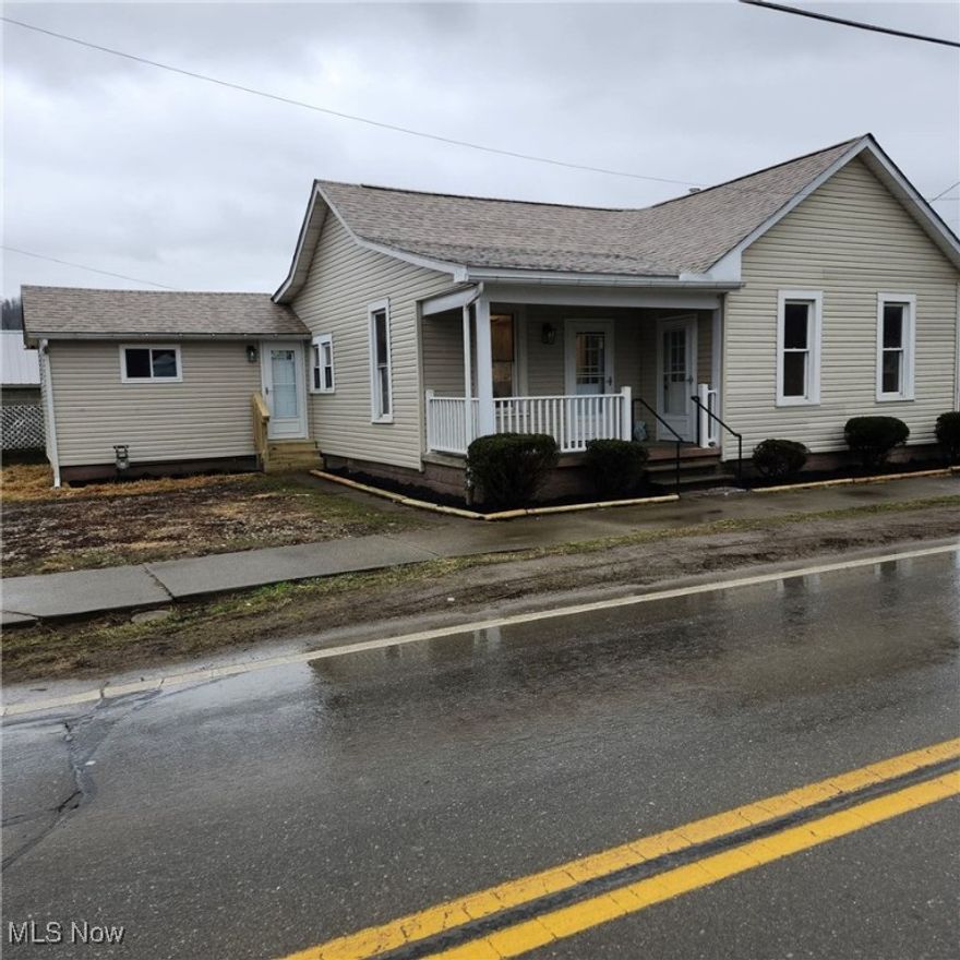 ALMOST BRAND NEW home now has 3 BEDROOMS and 2 FULL BATHS and SUPER CLOSE TO VILLAGE PARK!  This meticulous owner has renovated this one floor plan home to include a beautiful kitchen and dining area with breakfast bar, hickory cabinets (with lifetime warranty), newer stainless steel appliances, and Quartz countertops. A large living room allows plenty of room for entertaining.  The laundry area is conveniently located in the wide hallway near two of the bedrooms.  New roof, central air, ductwork and insulation in the attic, all new lighting, updated plumbing and wiring, new entry and storm doors, LVT flooring, plus beautifully stained woodwork and doors throughout.  3rd bedroom with high wood ceiling could be used as a family room. Gas stove, hot water tank, and newer gas furnace. Enjoy your morning coffee on the covered front porch while waving at the friendly neighbors going by.  Many high-end renovations will make you proud to call this your home.  Select your bedroom carpet with seller giving a carpet allowance with an acceptable offer.